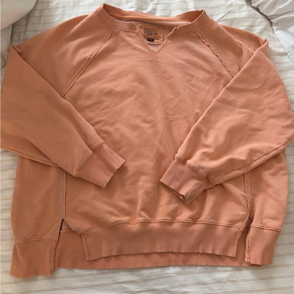American Eagle this feels seriously lived in light orange size large sweatshirt